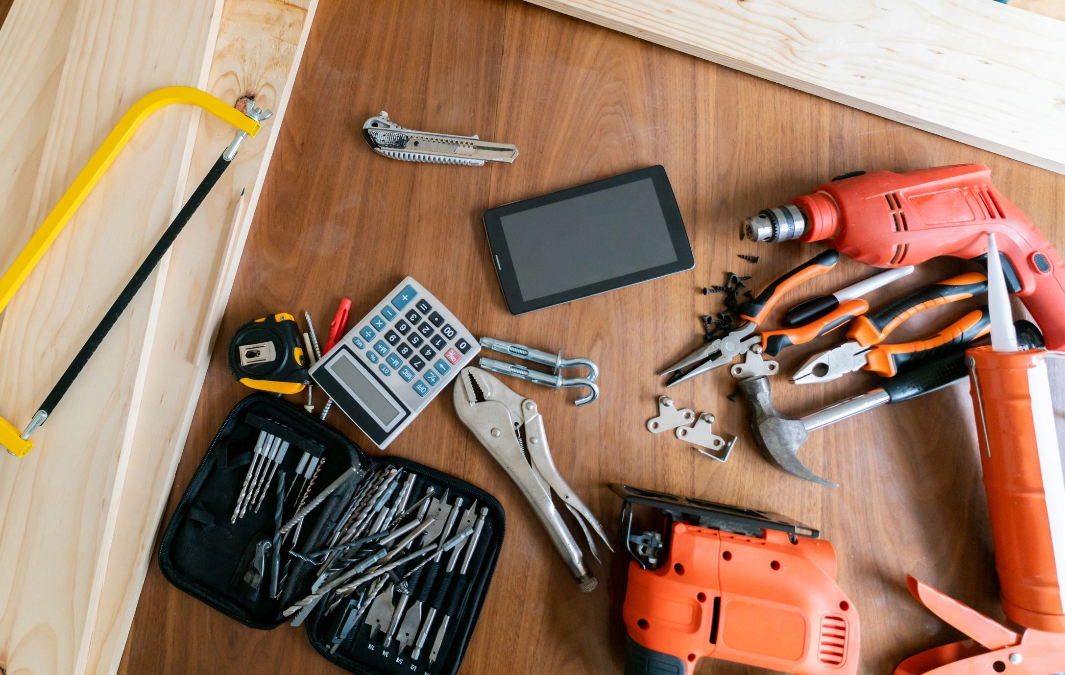 Plumbing and DIY tools arranged on a work table