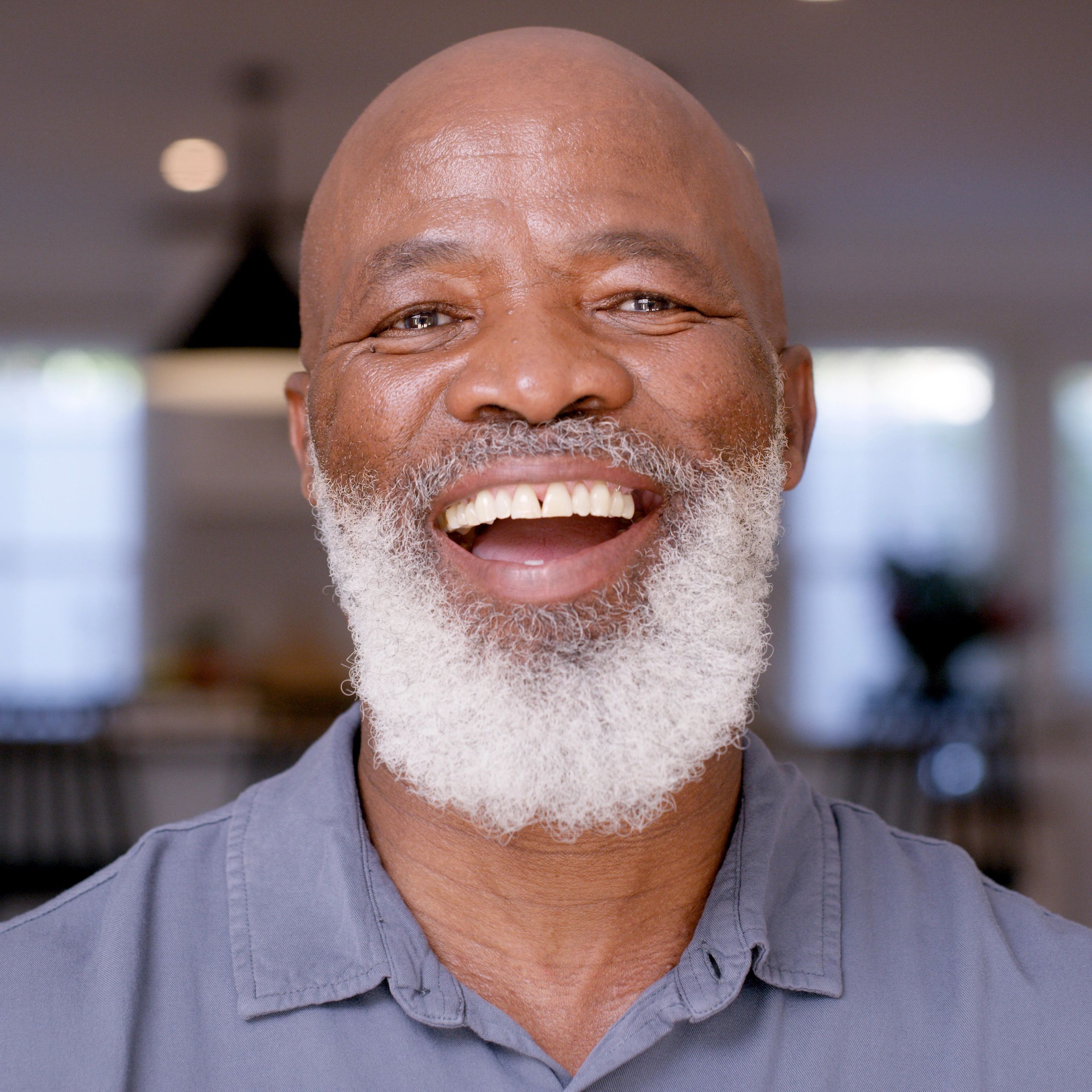 Portrait of a satisfied homeowner in a home setting